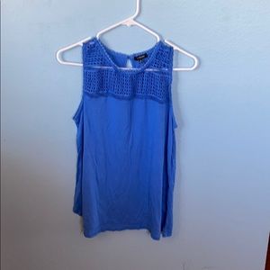 sky blue tank with cutout around neck
